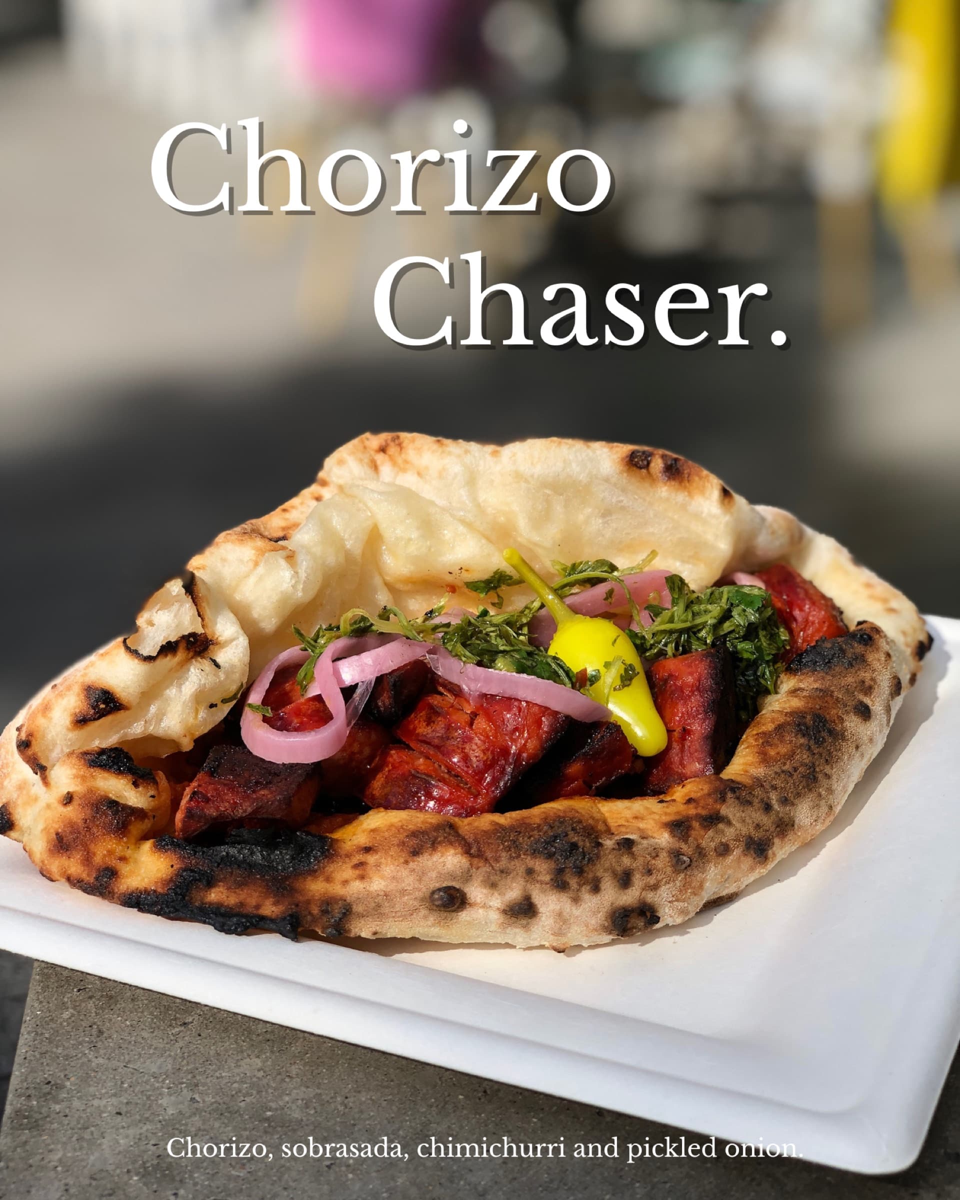 Chorizo Chaser ozzo on a white square plate — chorizo, sobrasada, chimichurri, pickled onion